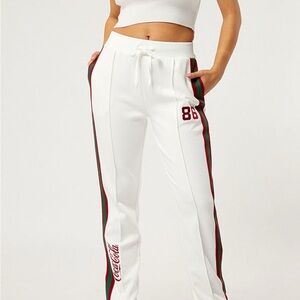 PacSun CocaCola Women's White Track Pants with Red and Green Stripes